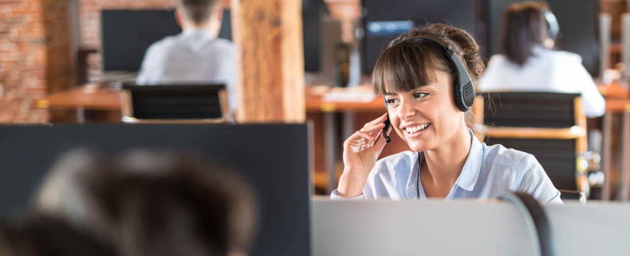 Female call centre employee managing omnichannel communications using MaxContact's Omnichannel Engagement Platform